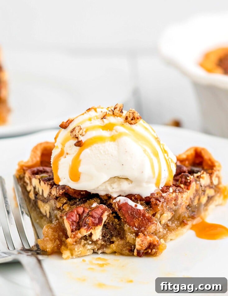 Decadent Maple Pecan Pie 8 A close-up of a delightful slice of pecan pie on a plate, with a bite playfully taken, generously topped with a dollop of vanilla ice cream and drizzled with luscious caramel sauce.