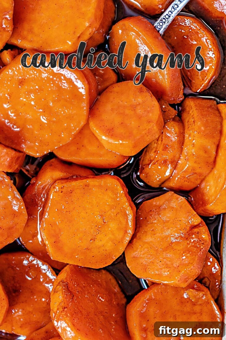 Close up of perfectly glazed candied sweet potatoes in a baking dish, ready to be served for Thanksgiving