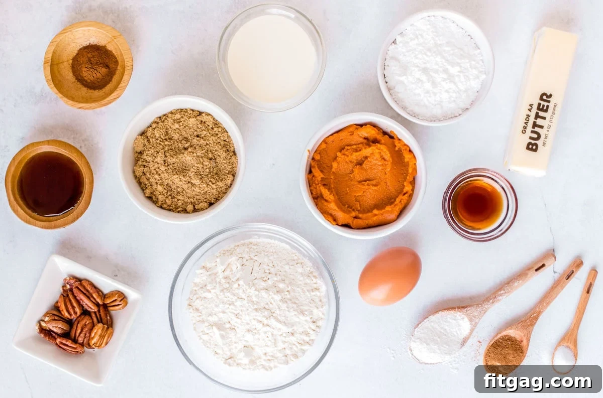 Individual ingredients for pumpkin scones measured out into small white bowls, neatly arranged for baking.