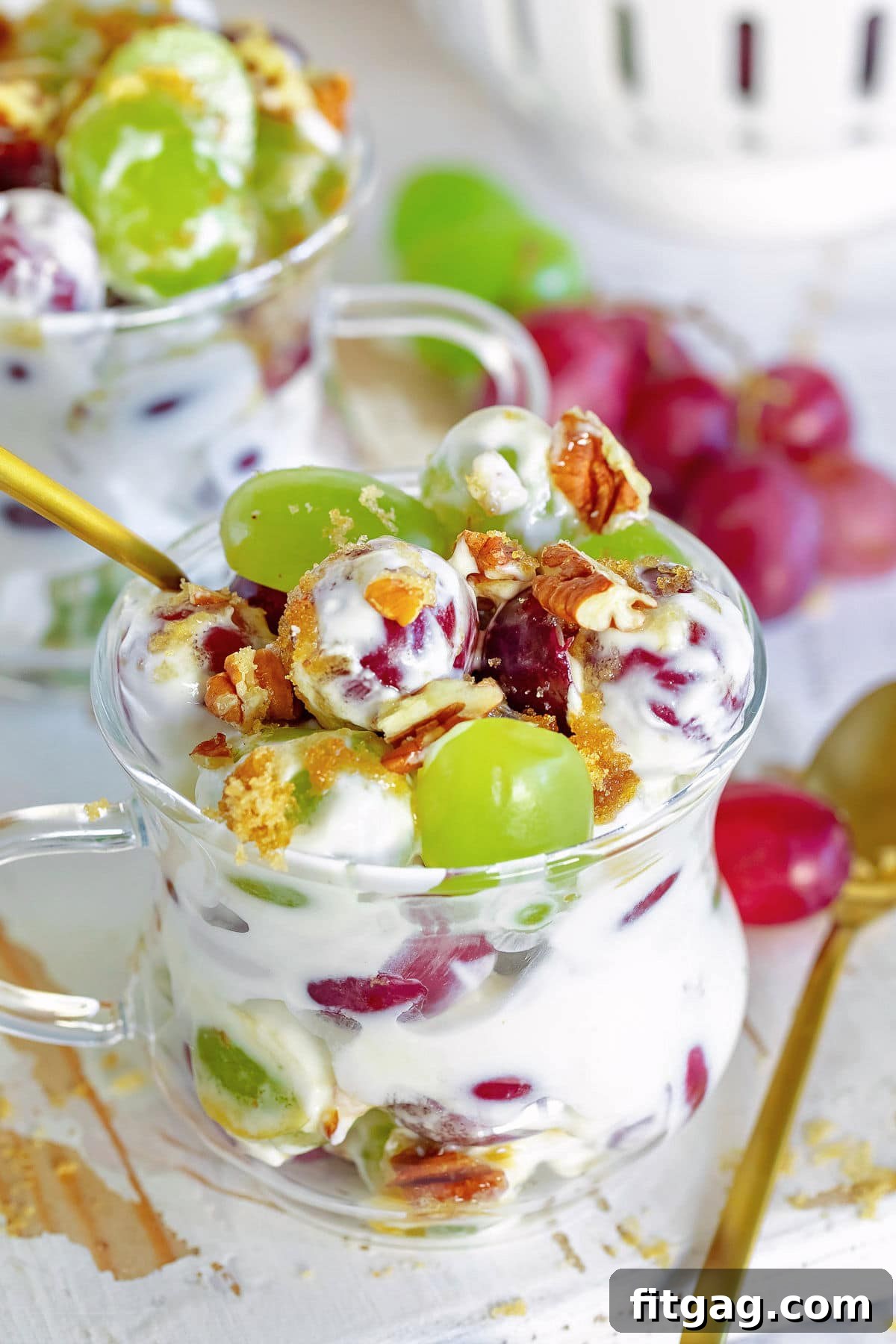 Creamy Grape Crunch 6 grape salad with cream cheese dressing in small cup with gold spoon