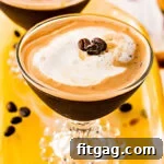 espresso martini recipe in two glasses on yellow glass tray top down view square