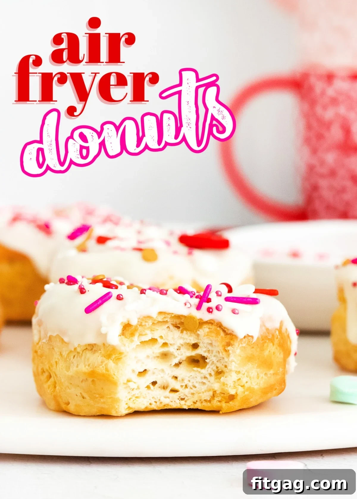 Air fryer donut with vanilla glaze and festive sprinkles, with a bite taken, ready to enjoy as a snack or breakfast treat.