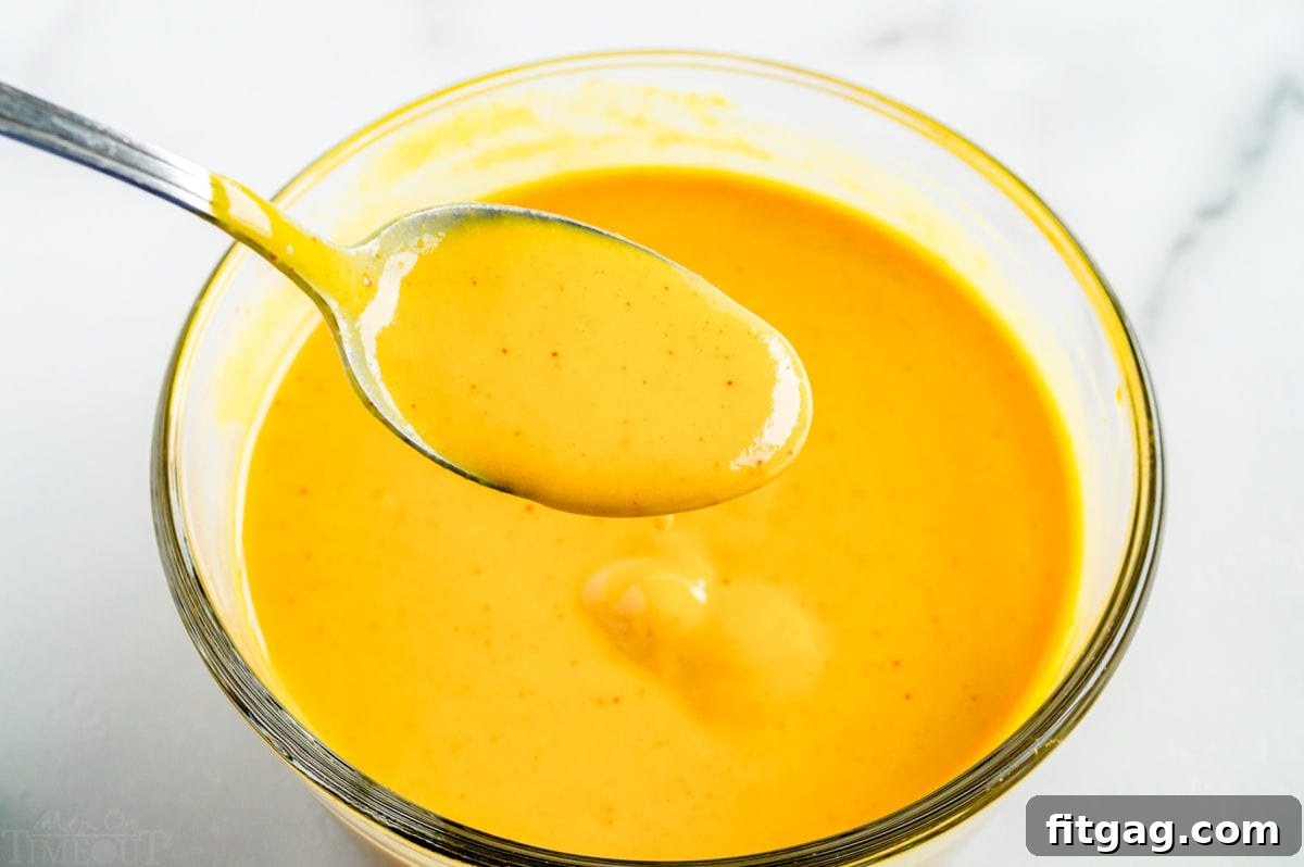 honey mustard in bowl with spoon.