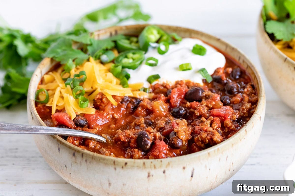 spoonful of turkey chili in bowl.