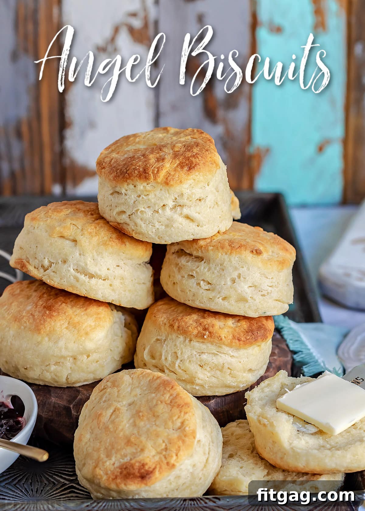 Piled high golden-brown Angel Biscuits in a vintage sheet pan, ready to be enjoyed.