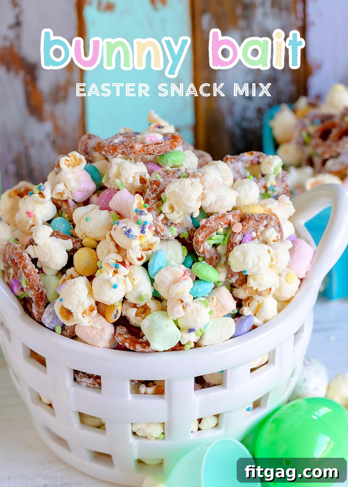 Hoppy Easter Snack Blend 2 A vibrant Easter snack mix in a white basket, featuring popcorn, pretzels, M&Ms, and marshmallows, ready for festive gatherings.
