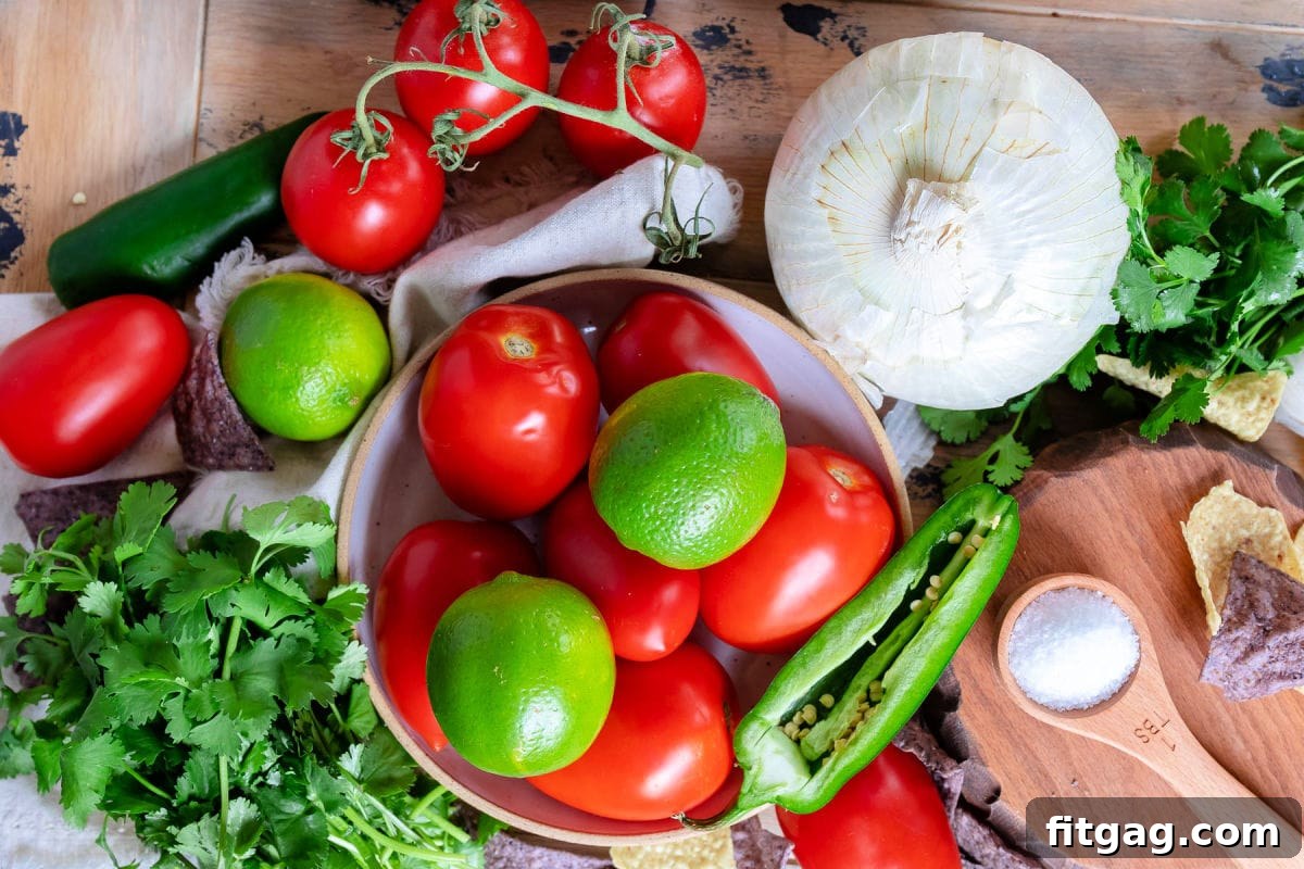 top down view of pico de gallo ingredients laid out on wood board. 