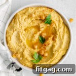 hummus in shallow white bowl.
