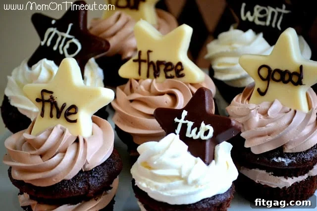 Close-up of All Stars Chocolate Cupcakes topped with chocolate stars and piped sight words, ready for a special celebration.