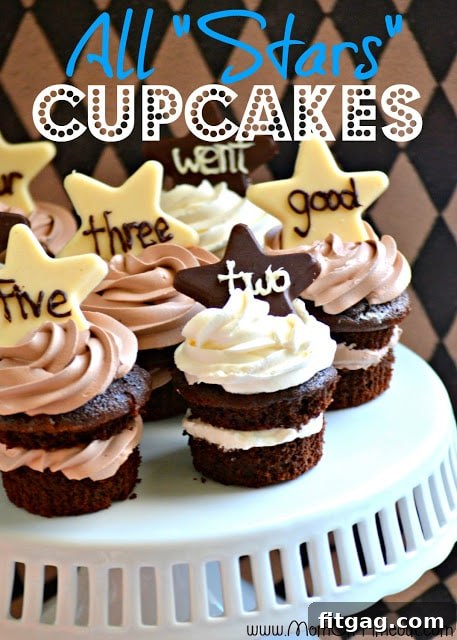 Reece proudly holding an All Stars Chocolate Cupcake with piped sight words.