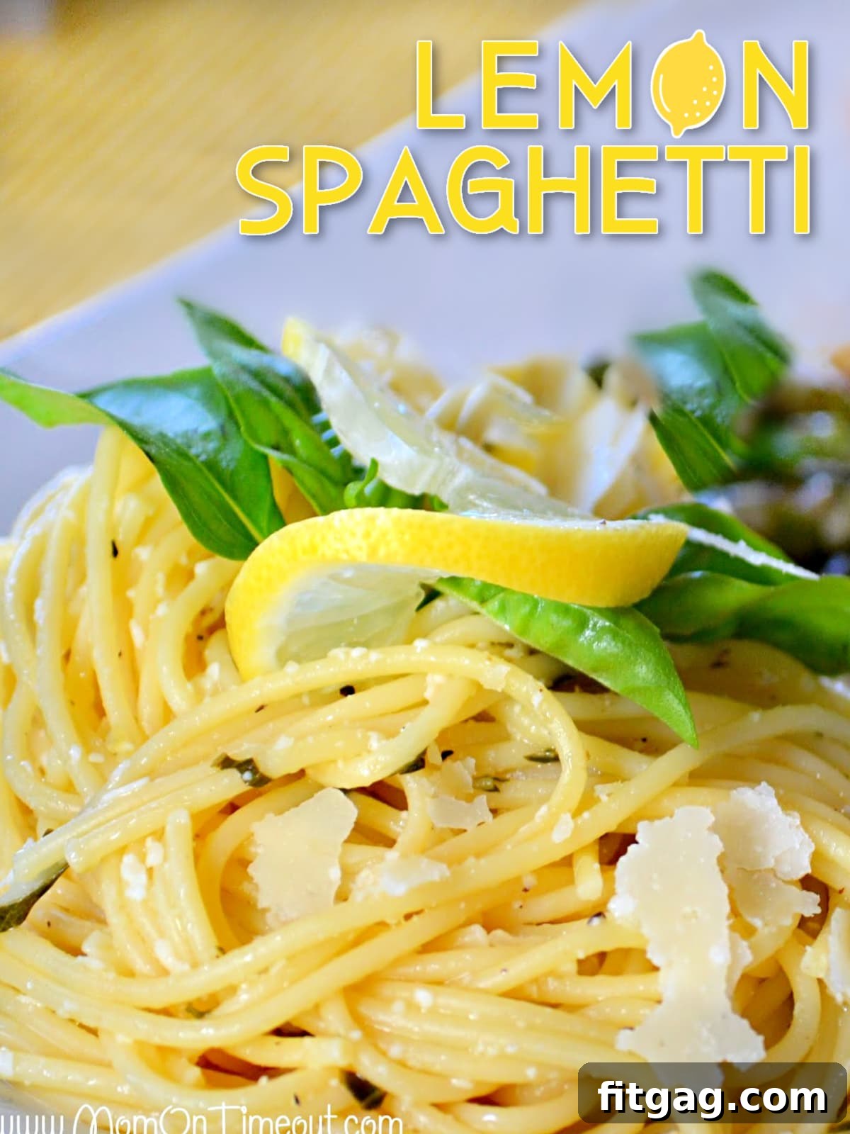 A beautifully plated dish of Lemon Spaghetti garnished with fresh Parmesan, a lemon wedge, and basil leaves, set against a rustic background with text overlay promoting the recipe.