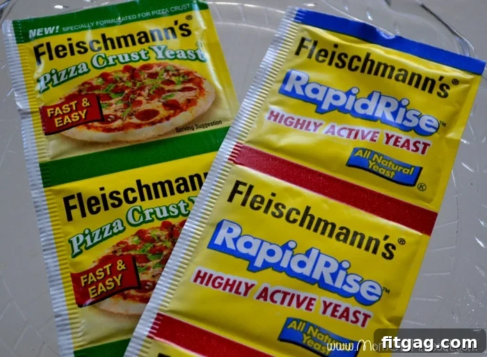 Image showcasing freshly prepared dough, cut into semi-straight strips with a pizza wheel, ready for wrapping around sausages. The dough looks smooth and pliable.