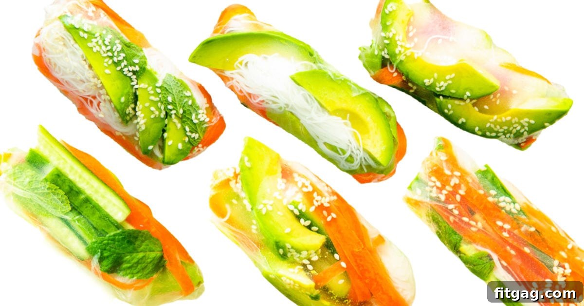 Six perfectly rolled spring rolls arranged on a white background, highlighting avocado and carrots as key ingredients.