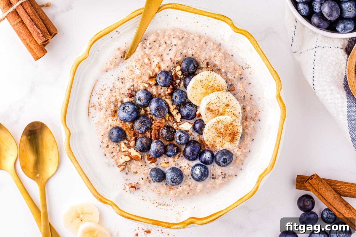 Creamy Instant Pot Steel Cut Oats 8 top down look at bowl of oatmeal topped with fresh fruit, pecans and cinnamon.