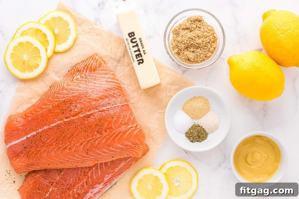 All the ingredients for baked salmon laid out neatly on a counter, ready for preparation.