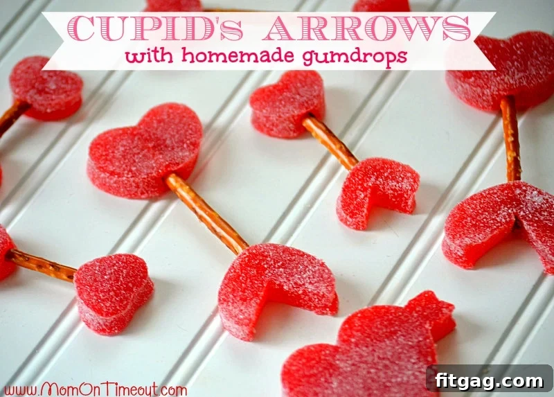 Homemade Valentine's Day Treats: Easy Cupid's Arrows with Gumdrops and Pretzels Close-up photograph of several finished Cupid's Arrows, highlighting their delicious and easy appeal as a Valentine's Day craft and treat.