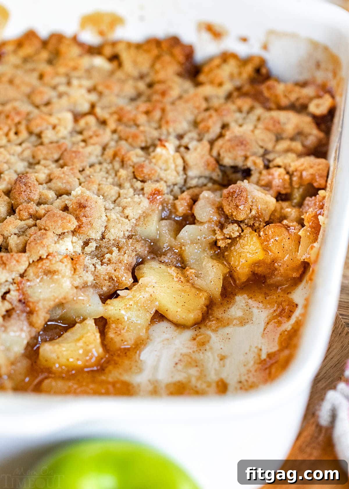 baking dish with a few servings of the apple crumble removed.
