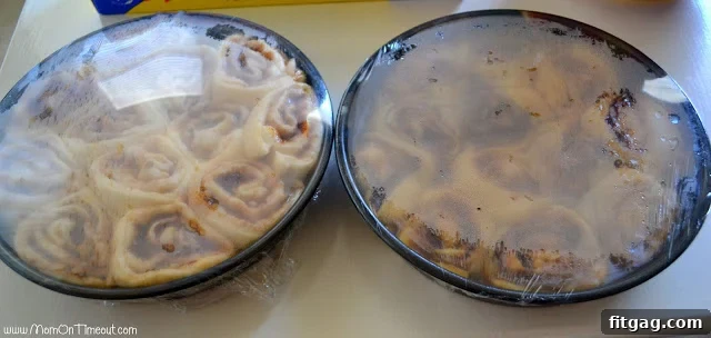 Sticky buns in a pan, risen and ready to be baked in a preheated oven.