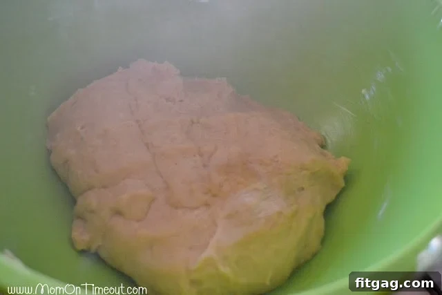 Sticky bun dough after its first rise, perfectly doubled in size and ready for shaping.