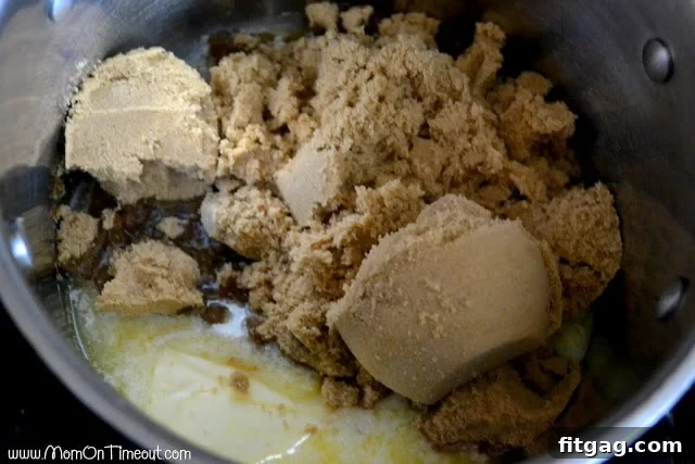Butter and brown sugar melting together in a heavy-bottomed pot, beginning the caramel sauce process.