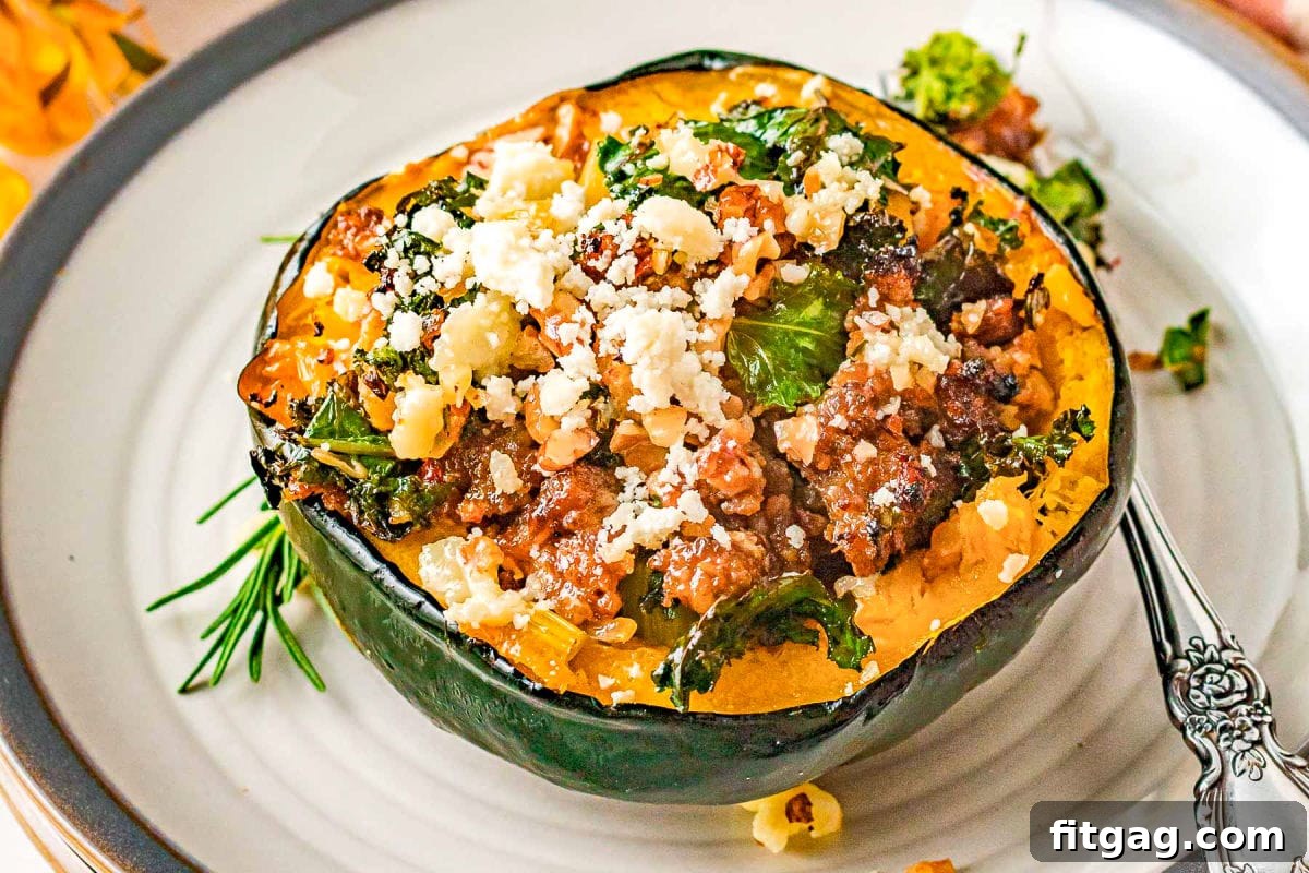 stuffed acorn squash on round white plate with gray edge topped with feta cheese and pecans.