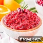 small white clay bowl filled with cranberry orange relish and ready to serve.