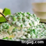 Velvet Peas 7 A large spoonful of creamy peas, perfect for serving.