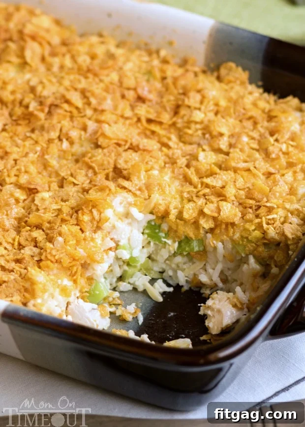 Rotisserie Chicken and Rice Casserole is an incredibly easy and delicious dinner that is perfect for busy weeknights! Comfort food FAST! This easy casserole is made with rotisserie chicken, rice, almonds, celery and more! A family favorite that I've been making for decades! // Mom On Timeout #chickencasserole #chickenricecasserole #rotisseriechicken #easydinners #easydinnerrecipe #dinnertime #dinner #chicken #casserole easy chicken casserole recipe with rotisserie chicken