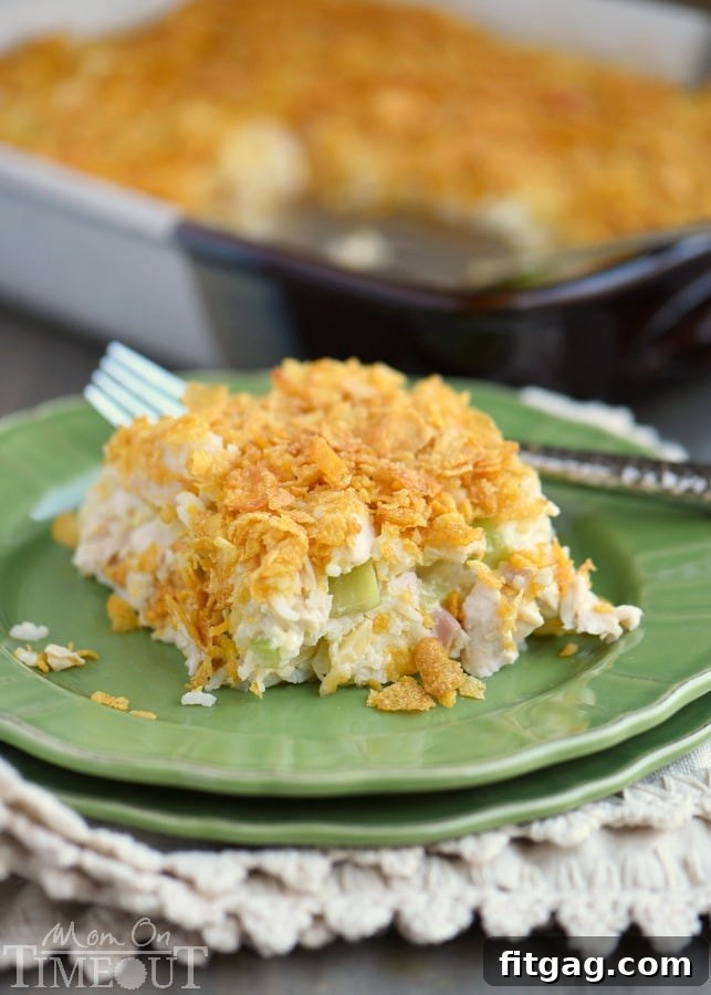 Rotisserie Chicken and Rice Casserole is an incredibly easy and delicious dinner that is perfect for busy weeknights! This easy casserole is made with rotisserie chicken, rice and almonds, celery and more! A family favorite that I've been making for decades! // Mom On Timeout #chickencasserole #chickenricecasserole #rotisseriechicken #easydinners #easydinnerrecipe #dinnertime #dinner #chicken #casserole chicken casserole with rice and cornflakes