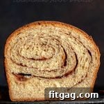 Effortless Cinnamon Swirl Bread 2 cinnamon bread recipe on rack slice cut