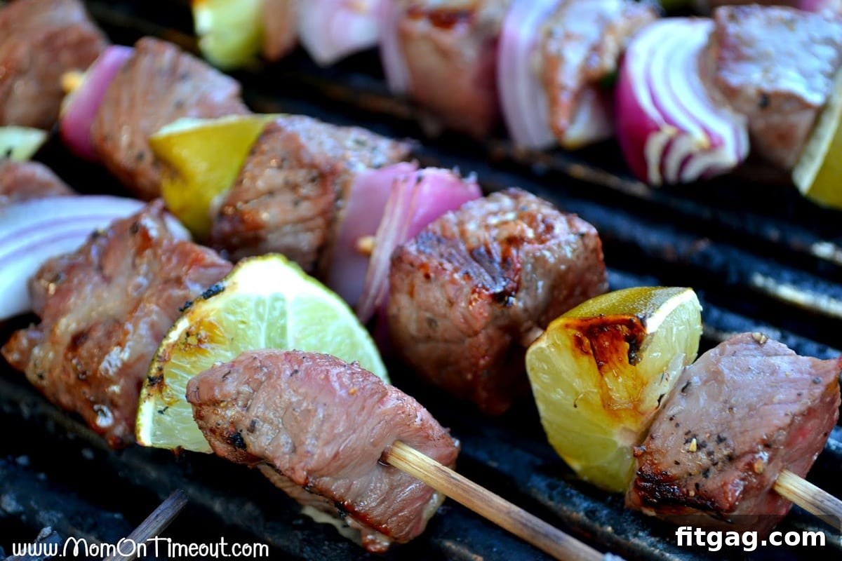 Mojo Beef Kabobs cooking on a hot grill, showing a perfect char