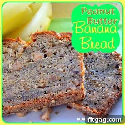 Two perfectly cut slices of moist Peanut Butter Banana Bread displayed on a white plate, with fresh bananas artfully arranged behind them.