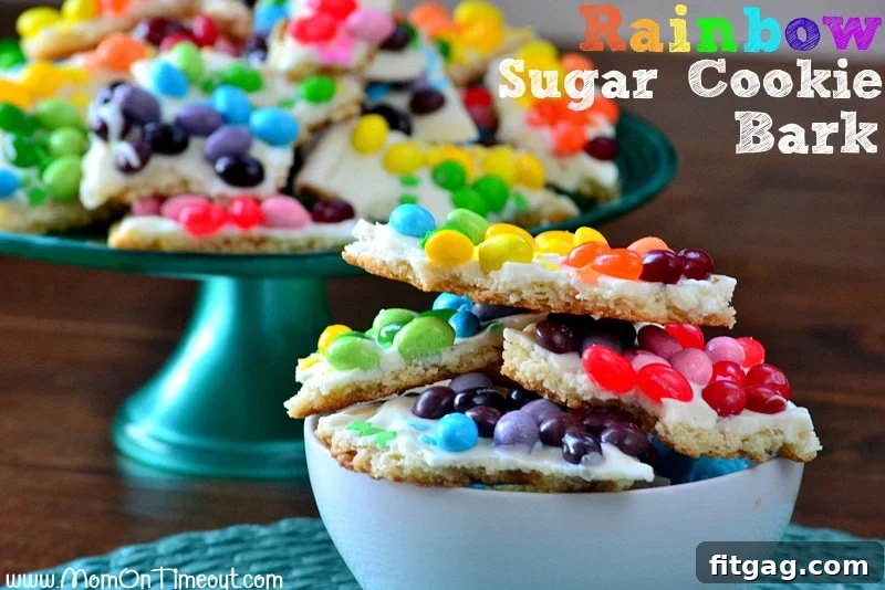 Confetti Sugar Cookie Bark 3 Close-up view of the vibrant Rainbow Sugar Cookie Bark, showing detailed candy placement and the smooth candy coating over the sugar cookie base. An ideal easy dessert recipe for celebrations.