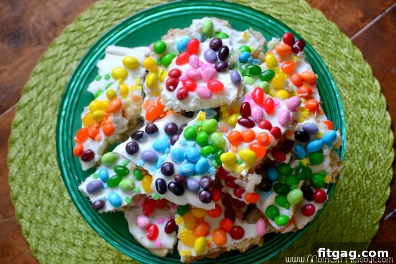 Confetti Sugar Cookie Bark 9 Top-down view of the finished Rainbow Sugar Cookie Bark, beautifully arranged on a cake plate, with each piece showcasing multiple vibrant colors. A stunning and easy dessert.