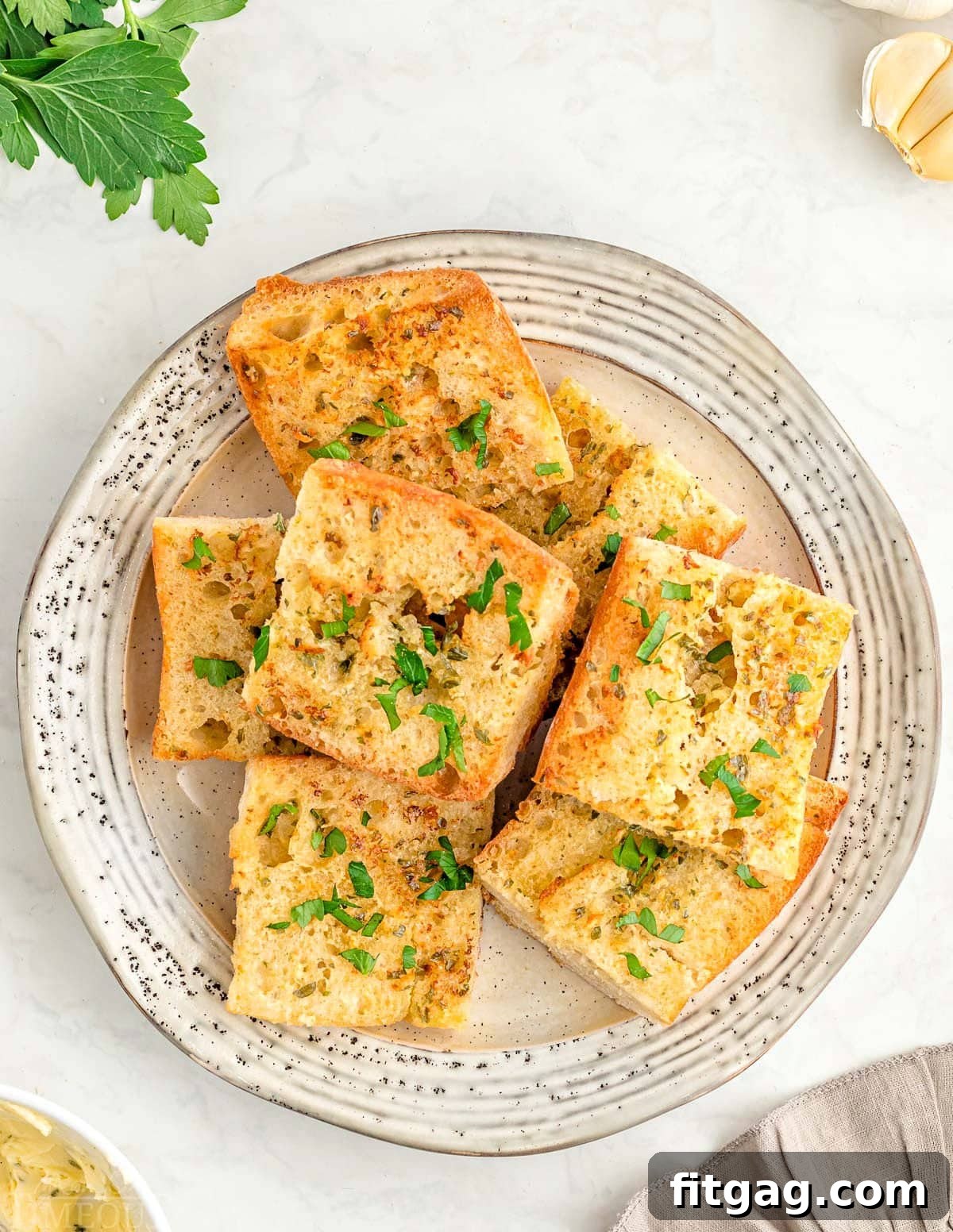 Crispy Air Fryer Garlic Bread 6 top down look at plate with garlic bread made in air fryer.