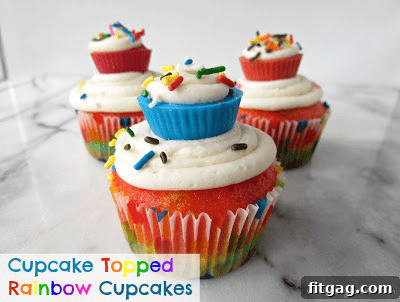 Creative Cupcake Topped Rainbow Cupcakes, featuring miniature cupcakes as decorations on larger, colorful cupcakes.