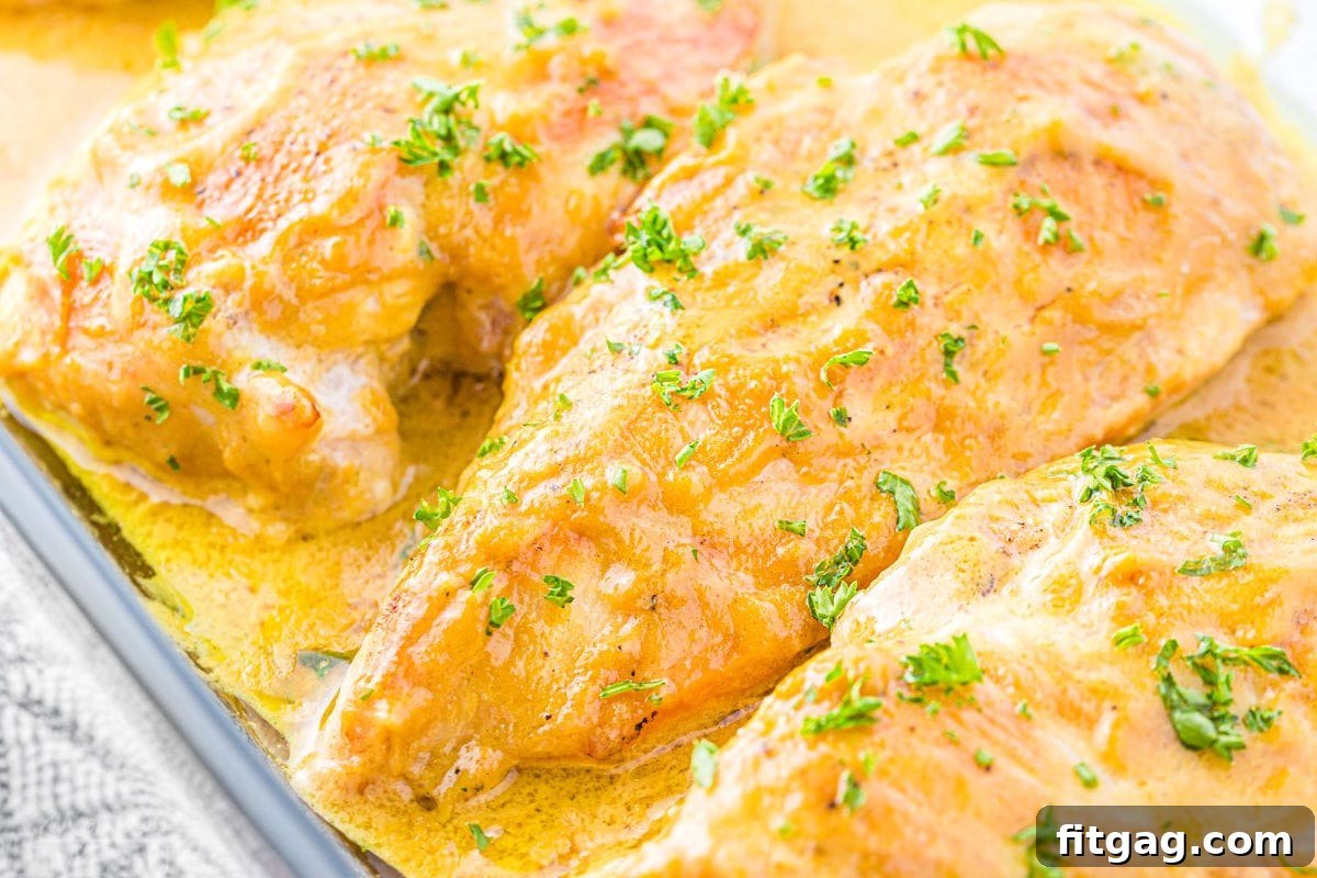 Crispy Honey Mustard Chicken Bites 4 A glass baking dish filled with perfectly baked honey mustard chicken breasts, each coated in the savory sauce and ready to be served family-style.