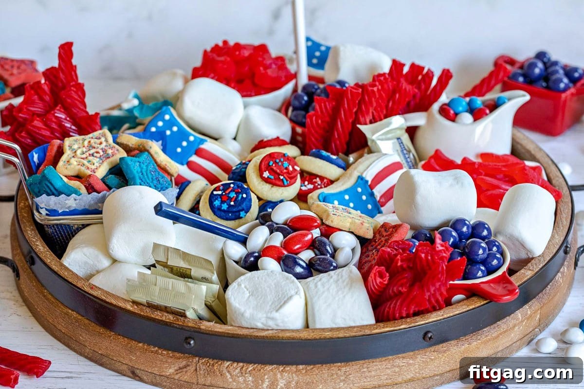 Stars and Stripes Grazing Board 4 A festive dessert board prepared for the 4th of July, brimming with an assortment of red, white, and blue candies and sweet treats, artfully arranged for a holiday celebration.