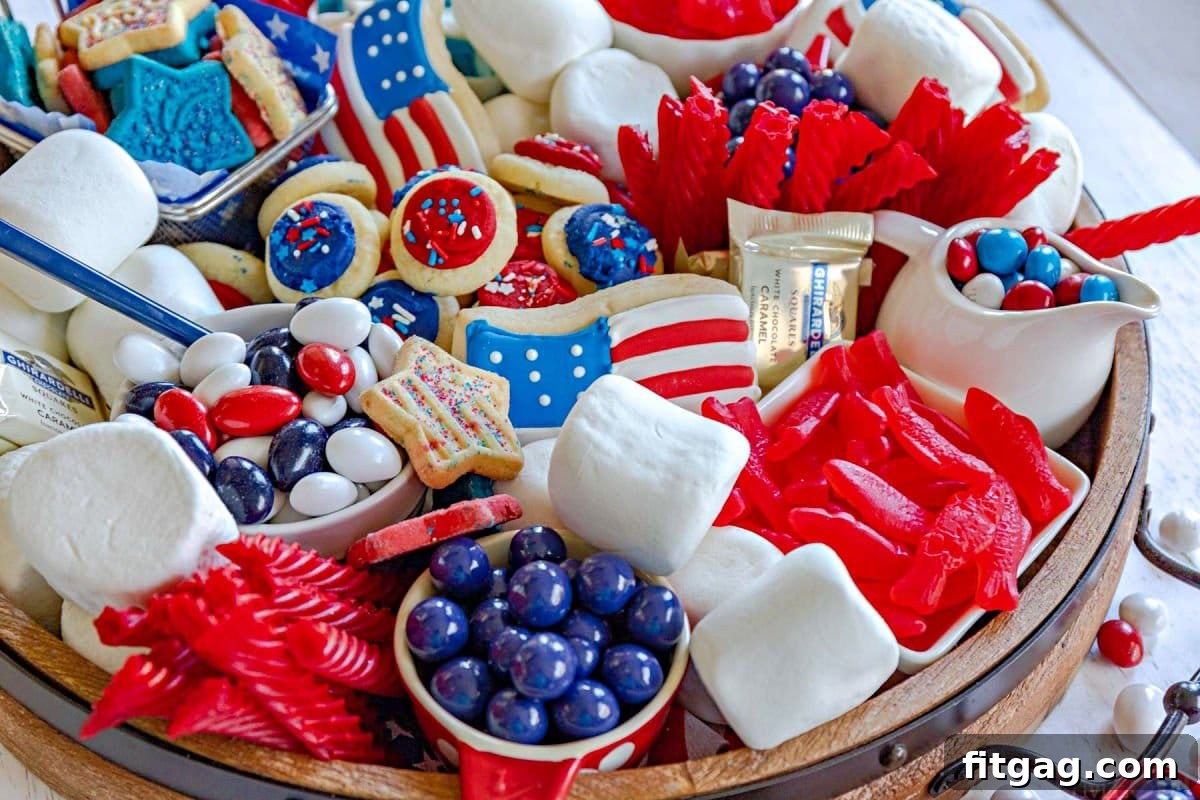 Stars and Stripes Grazing Board 6 A vibrant 4th of July dessert board, meticulously prepared with an assortment of red, white, and blue candies and treats, ready for a patriotic celebration.
