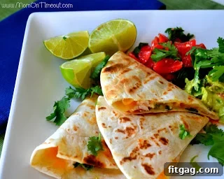 Fresh ingredients laid out for grilled shrimp quesadillas, including raw shrimp, fresh limes, and cheese