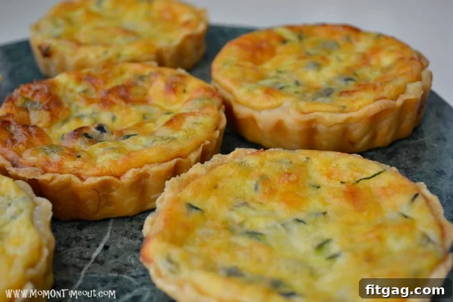 A beautifully baked Zucchini and Green Chile Quiche, presented in a pie dish, perfect for sharing.