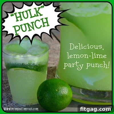 Close-up of the green, foamy Lemon Lime Party Punch in a glass pitcher, ready to serve.