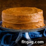 A delectable caramel cake, sliced and ready to serve, showcasing the rich layers and luscious frosting.