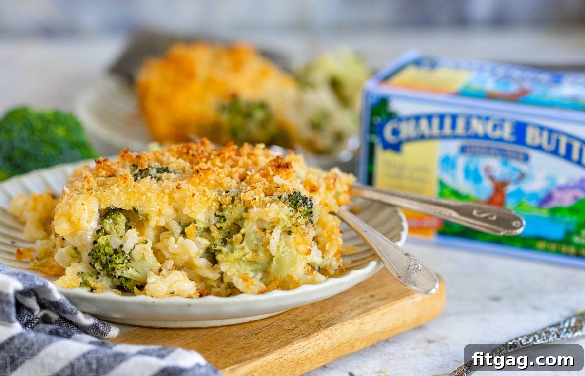 serving of broccoli casserole on a small plate with a box of butter in the background.