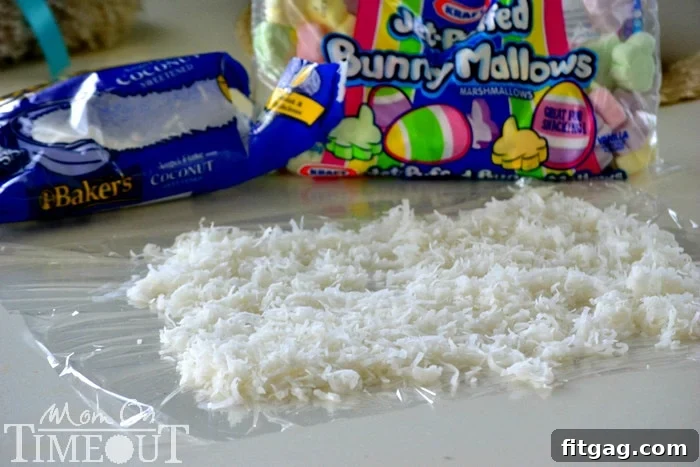 A bowl filled with colorful marshmallows and melted candy coating, ready to be mixed, alongside a pile of shredded coconut.