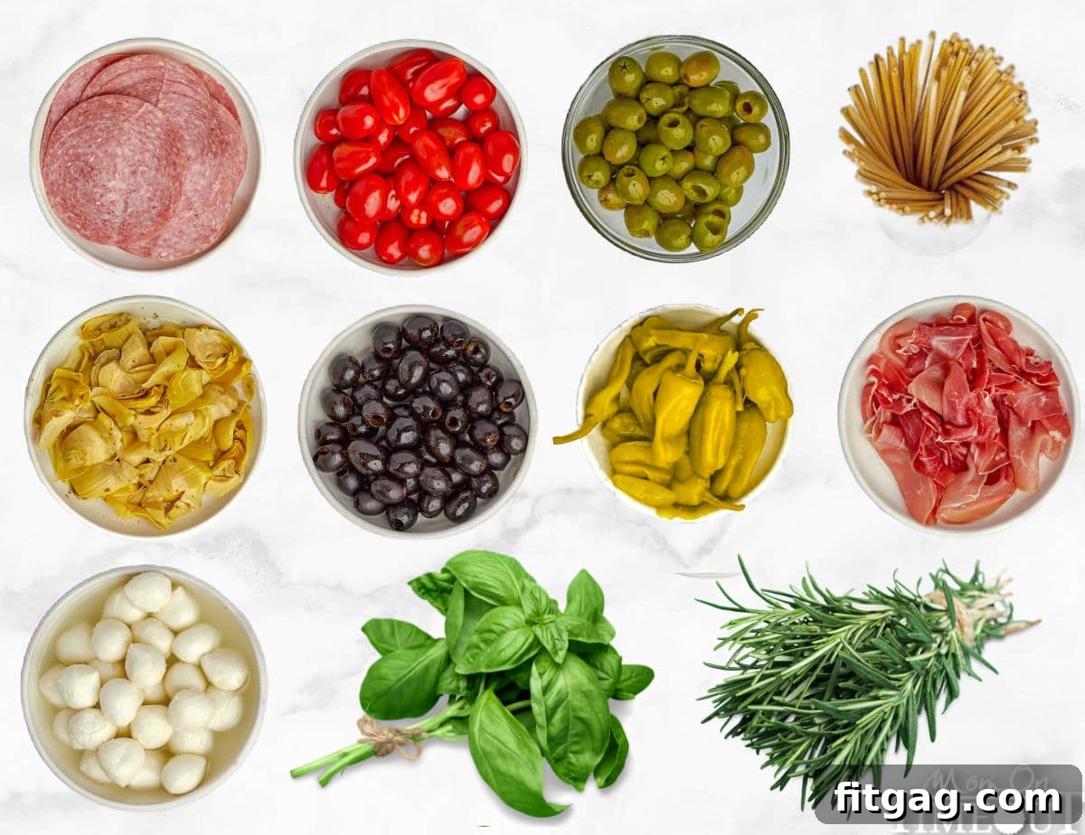 all the ingredients for a charcuterie wreath laid out in small bowls ready to assemble.