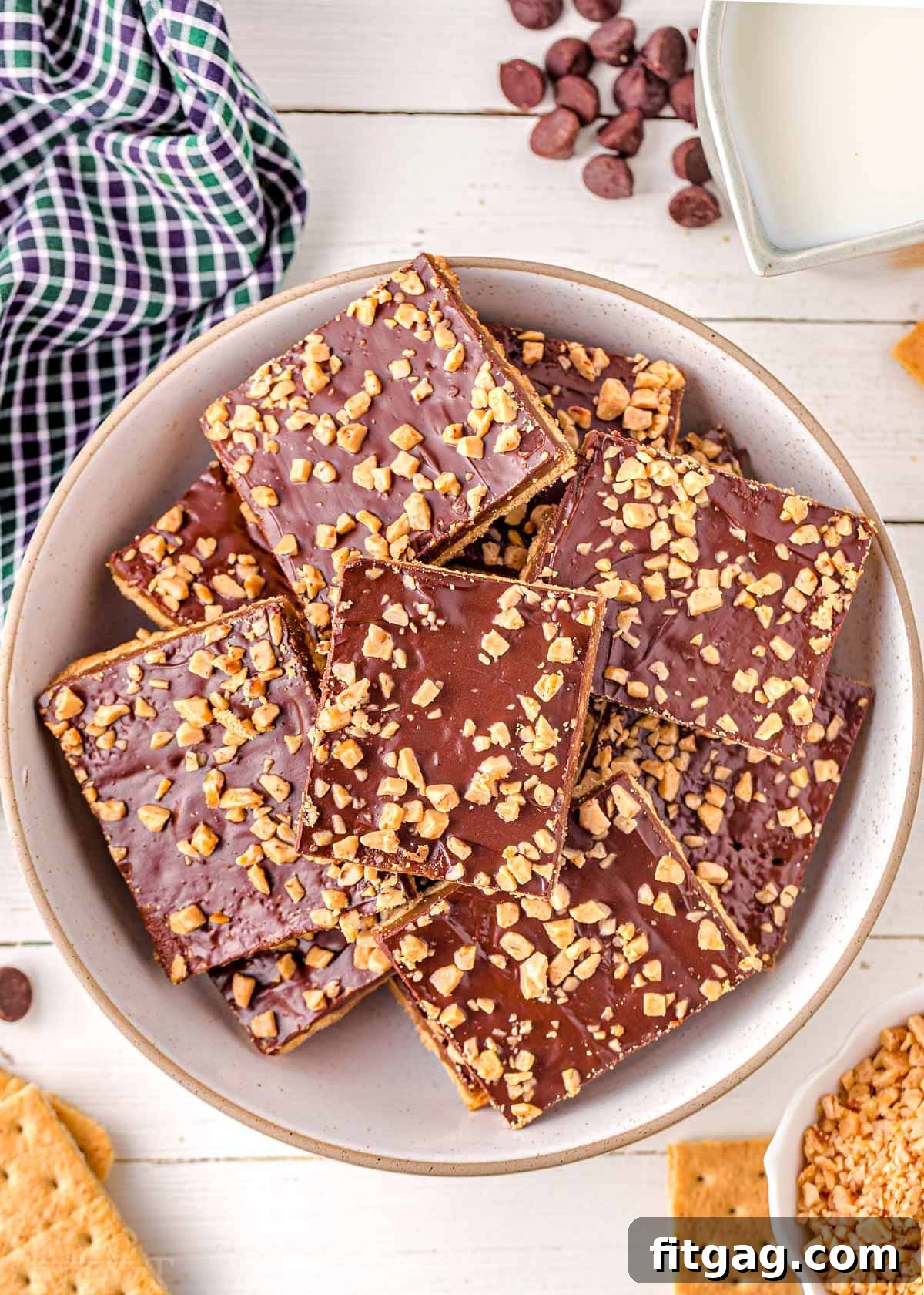 Decadent Graham Toffee Bark 5 top down look at white round plate piled high with graham cracker toffee.