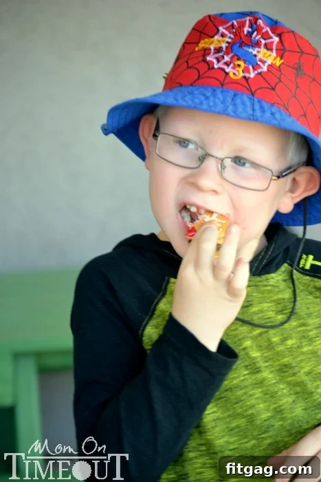 Sweet Cheeseburger Sliders 8 A child happily eating a cookie slider, showcasing its delicious appeal.
