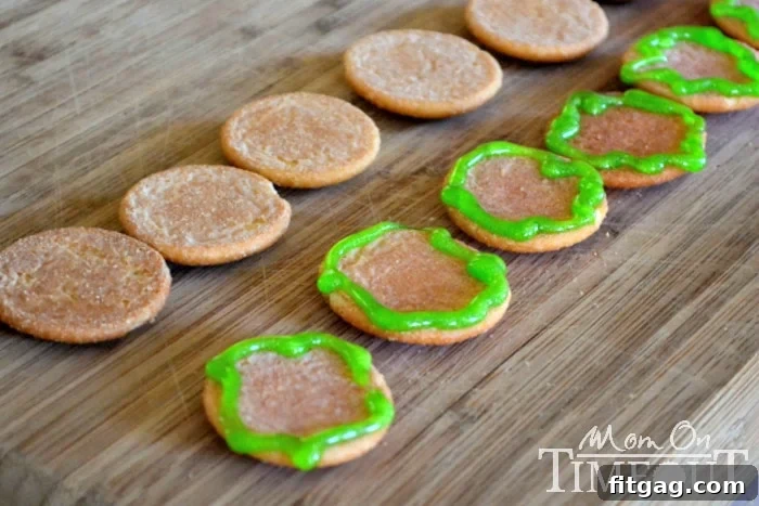 Sweet Cheeseburger Sliders 2 Nilla Wafers prepared with green icing to resemble lettuce for cookie sliders.
