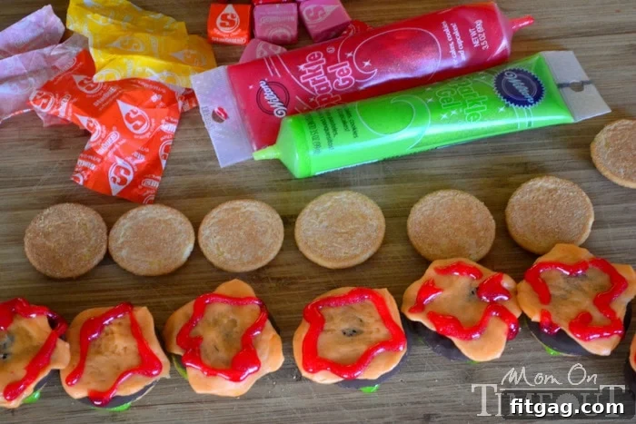Sweet Cheeseburger Sliders 5 Red frosting applied to the cookie slider to represent ketchup.